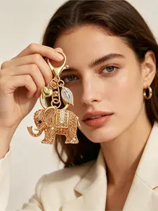 Colorful Lucky Elephant Keychain for Women. Made of durable alloy with sparkling crystals. Adorned with heart and leaf pendants, equipped with lobster clasp. Exquisite charm for car keys, bags and purses.