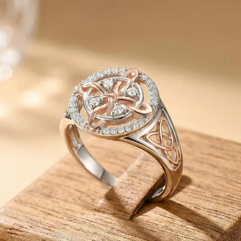 Elegant two-tone ring with hollow interwoven Celtic knot design. Surrounded by shimmering cubic zirconia. Polished craft, classic Irish vintage style, perfect daily wear and holiday gift.national gf day gift,Female gifts