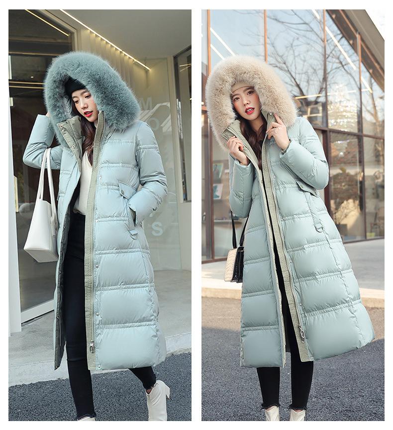 New winter women's thickened long over-the-knee hooded cotton-padded coat with large fur collar.