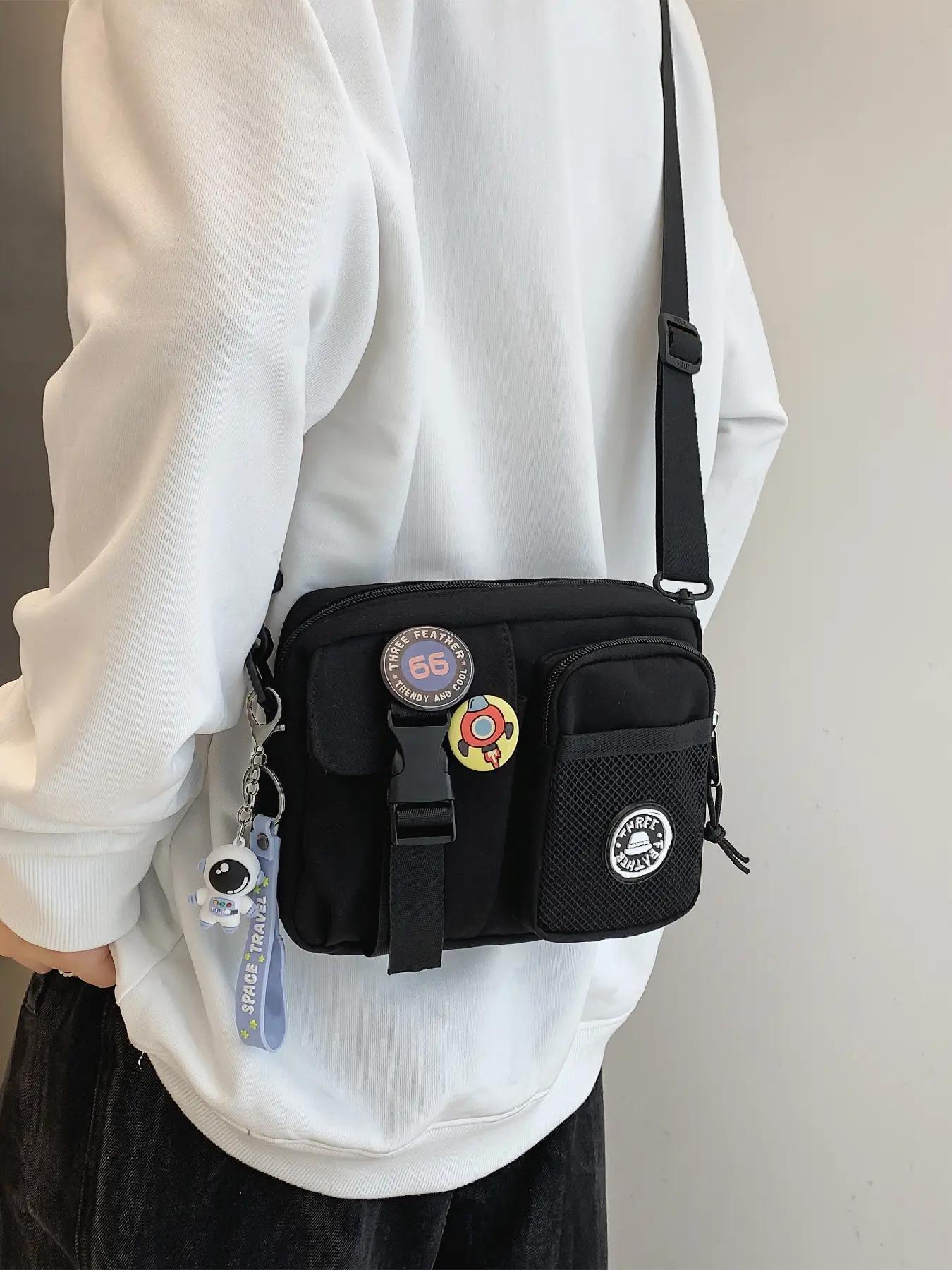 Unisex Casual Plain Color Release Buckle Crossbody Bag with Astronaut Charm, Fashionable Versatile Zipper Crossbody Bag with Random Color Badge, Trendy Shoulder Bag for Daily Use, Casual Messenger Bags, Stylish Crossbody Bags