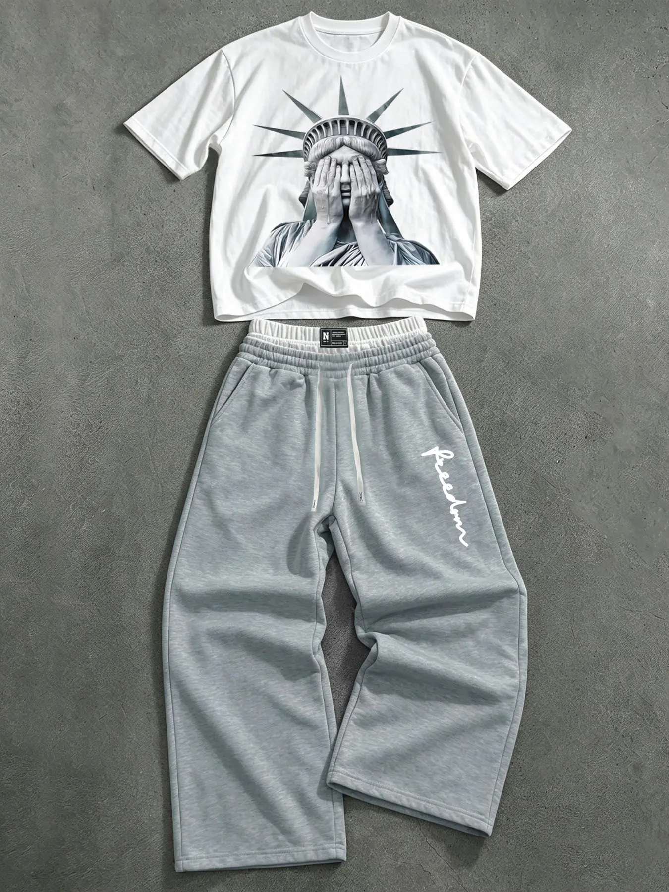 American-style Statue of Liberty print short-sleeved set for men and women, double drawstring waistband, wide-leg sweatpants, casual two-piece set.