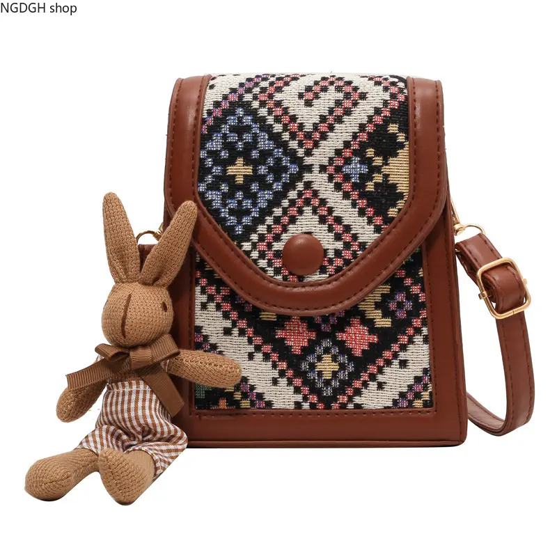 Women's Vintage Crossbody & Shoulder Bag with Geometric Pattern - Woven Polyester Purse with Adjustable Braided Back Strap, Metal Hardware & Bunny Charm, Back Strap Women's Crossbody & Shoulder Bags, Casual, Cold Wash, Cute, Messenger Bag