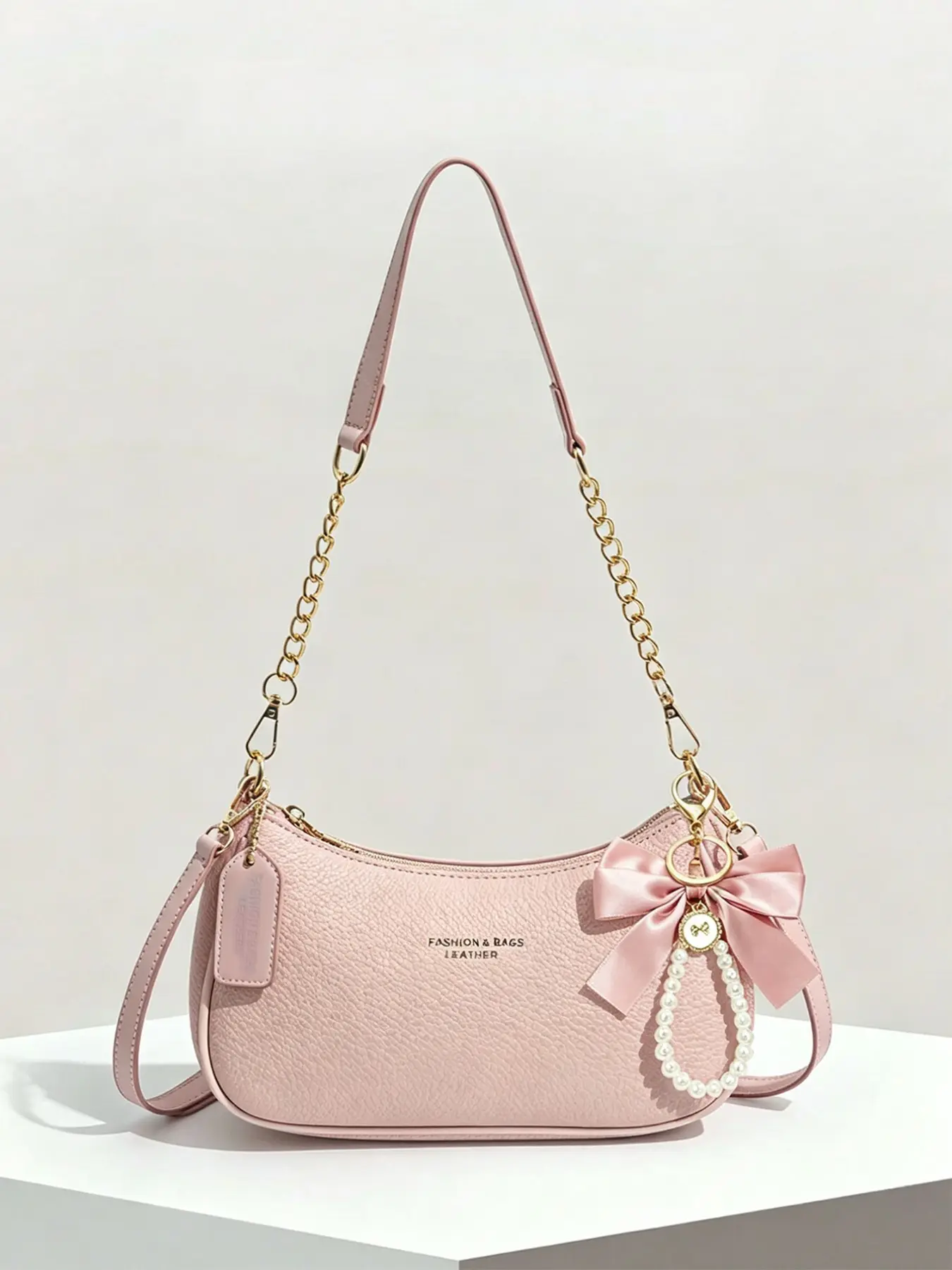 Gentle, sweet, fashionable and practical texture underarm bag with bow and pearl hanging decoration, chain splicing shoulder strap design, crescent shaped stick design, fashionable Casual Crossbody bag, suitable for commuting and dating, Casual Trendy Bag
