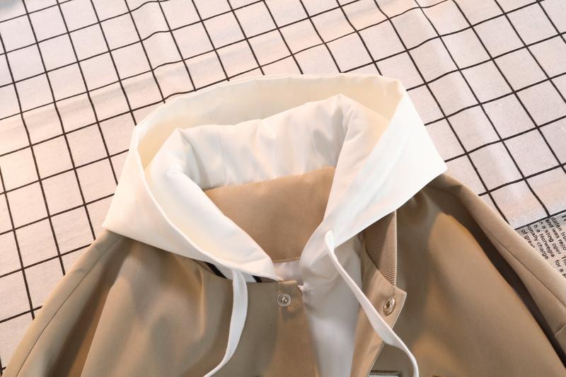 A hooded letter jacket, featuring a casual and simple style. The hooded design is sleek and elegant, while the overall design is practical and versatile. The letter embroidery adds a touch of sophistication, and the striped accent at the cuffs completes t