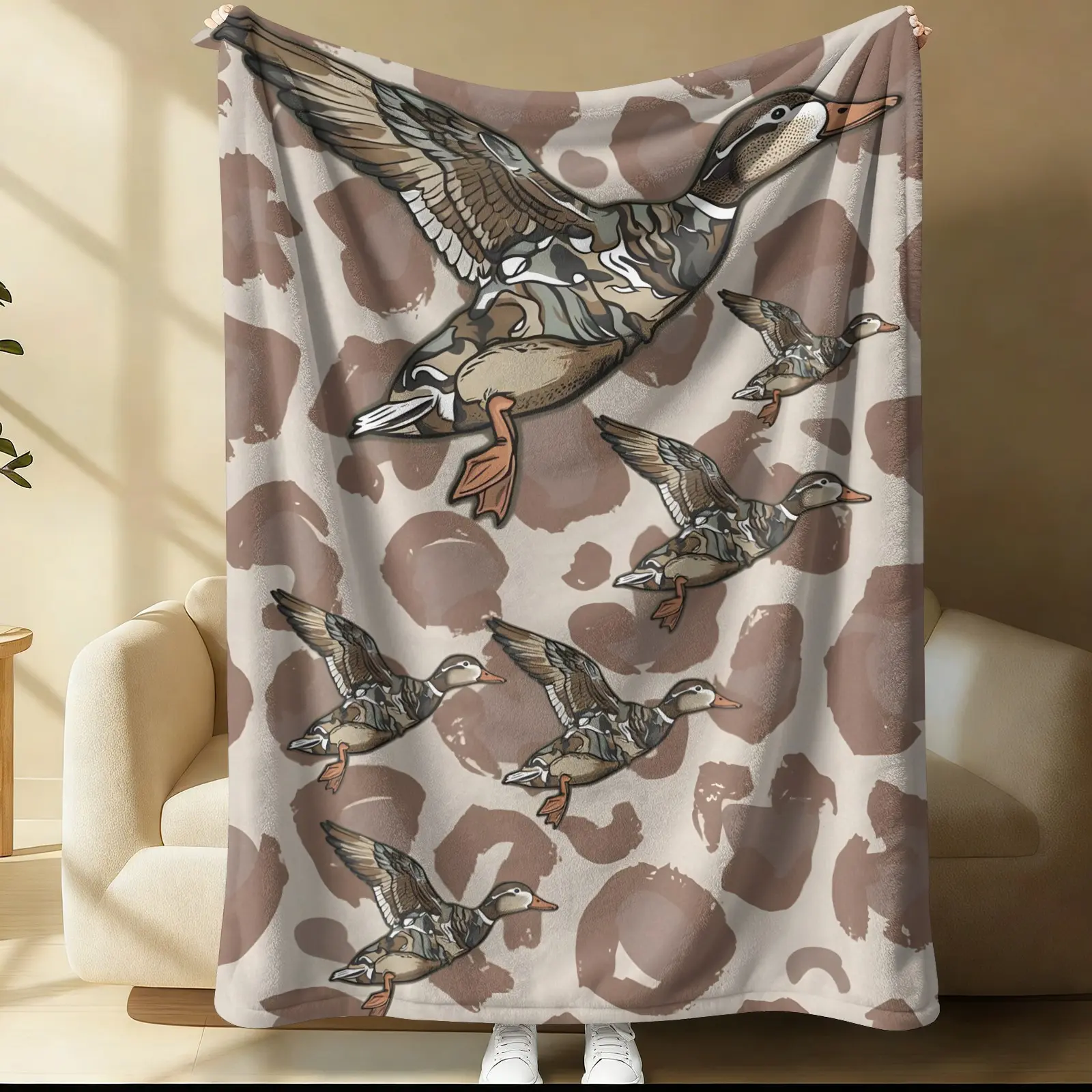 Bedding Featuring Flying Wild Ducks and Camouflage Patterns, Along With A Vintage-Style Mallard Print Blanket; Soft and Comfortable Decor For The Bedrooms Of Outdoor Hunting Enthusiasts, As Well As Lightweight and Portable Gear For Camping Trips.