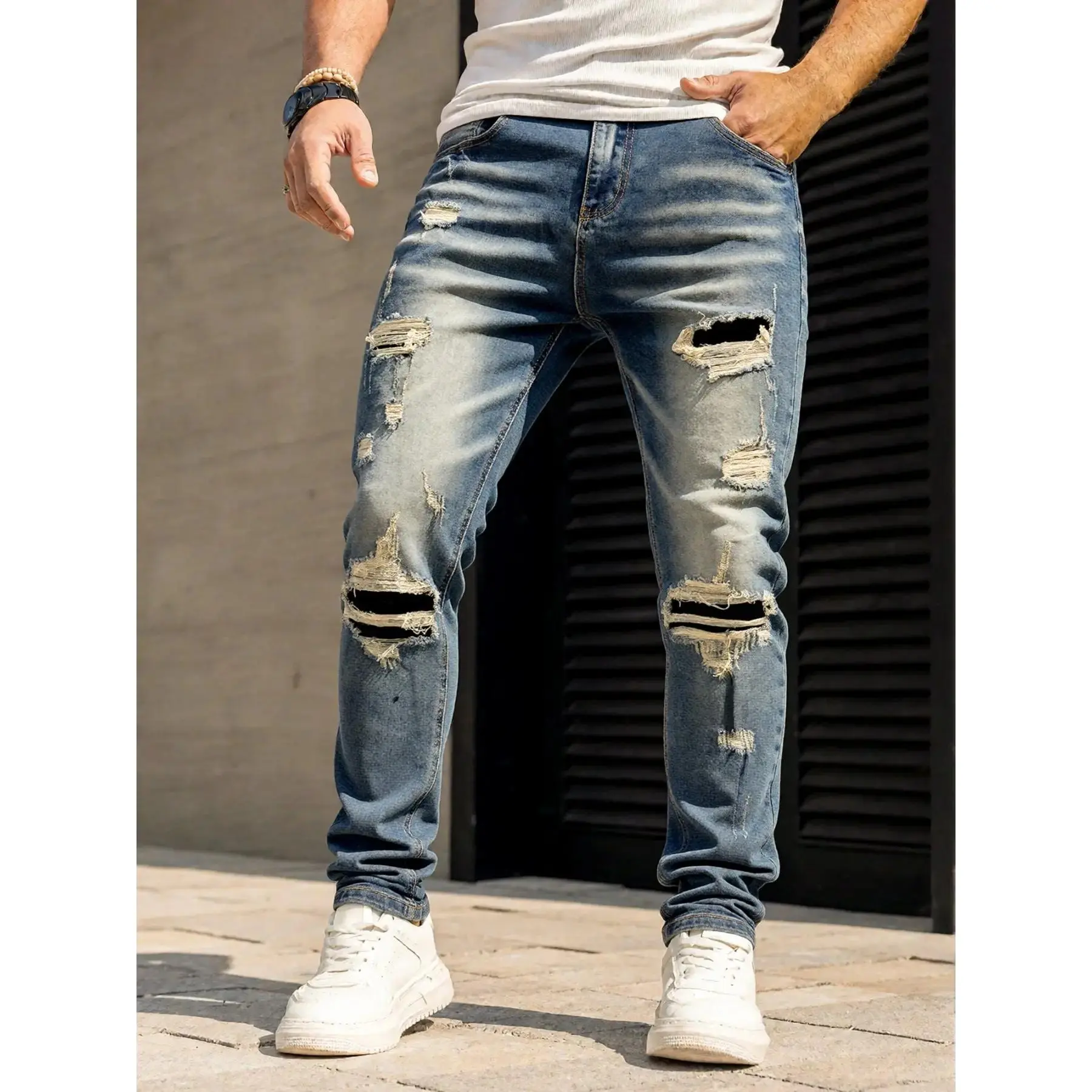 Men's jeans with cut and patched hole craftsmanship, retro blue slim stretch Denim fabric, multiple dark patches and irregular tear designs, vintage washed retro street style Streetwear