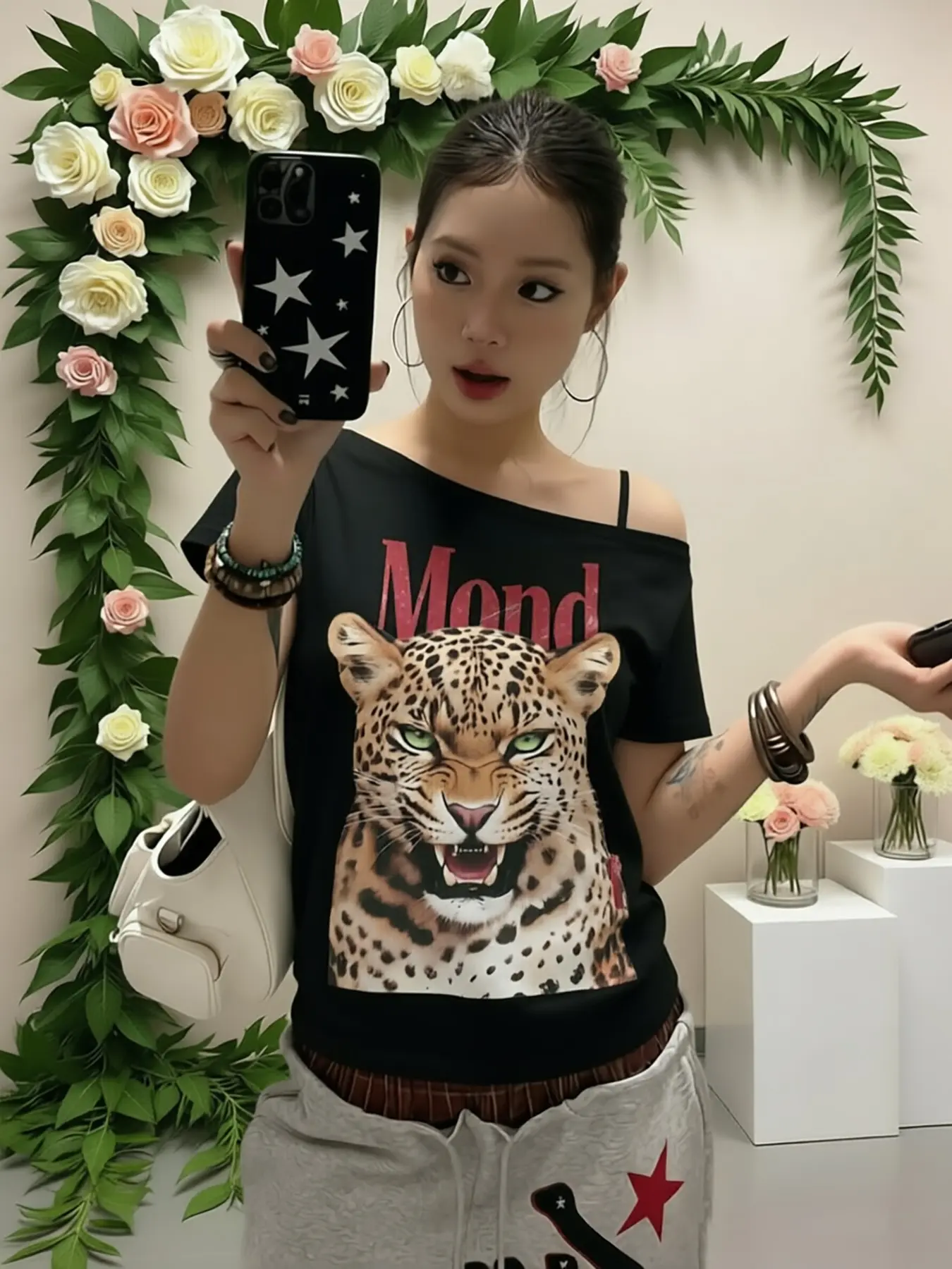 Women's Y2K off-shoulder short-sleeve T-shirt featuring a vintage roaring cheetah print and distressed red lettering; a fitted, cute, streetwear-style one-shoulder top with a trendy hip-hop vibe.