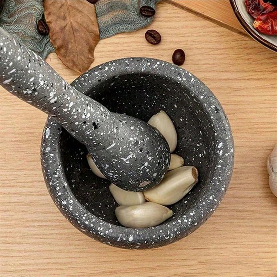 A practical garlic grinder with a mortar, a multi-functional manual food grinder, a kitchen crushing tool, a household garlic grinder, and a spice tool