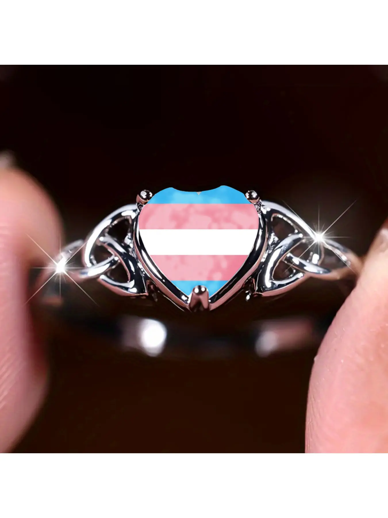 This silver ring features Celtic eternal knots on both sides, and the heart surface is printed with the transgender pride flag. The blue, pink and white stripes represent the diverse gender identities. The Celtic knot symbolizes eternity and resilience, w