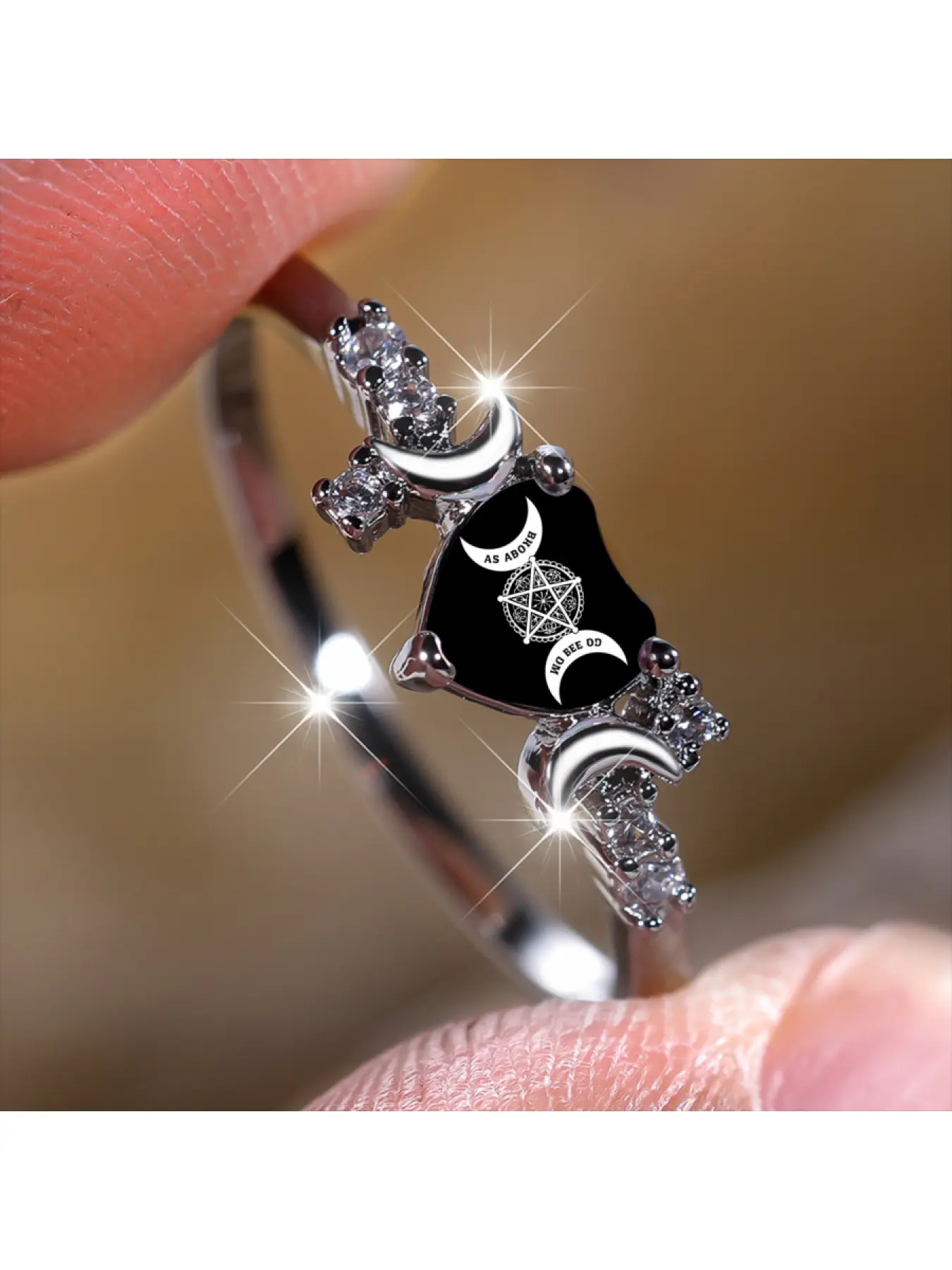 Black background star and moon rune pattern ring, adorned with symmetrical crescent moon and flashing diamonds, cold and ascetic style, a niche and atmospheric accessory for daily stacking and taking great photos