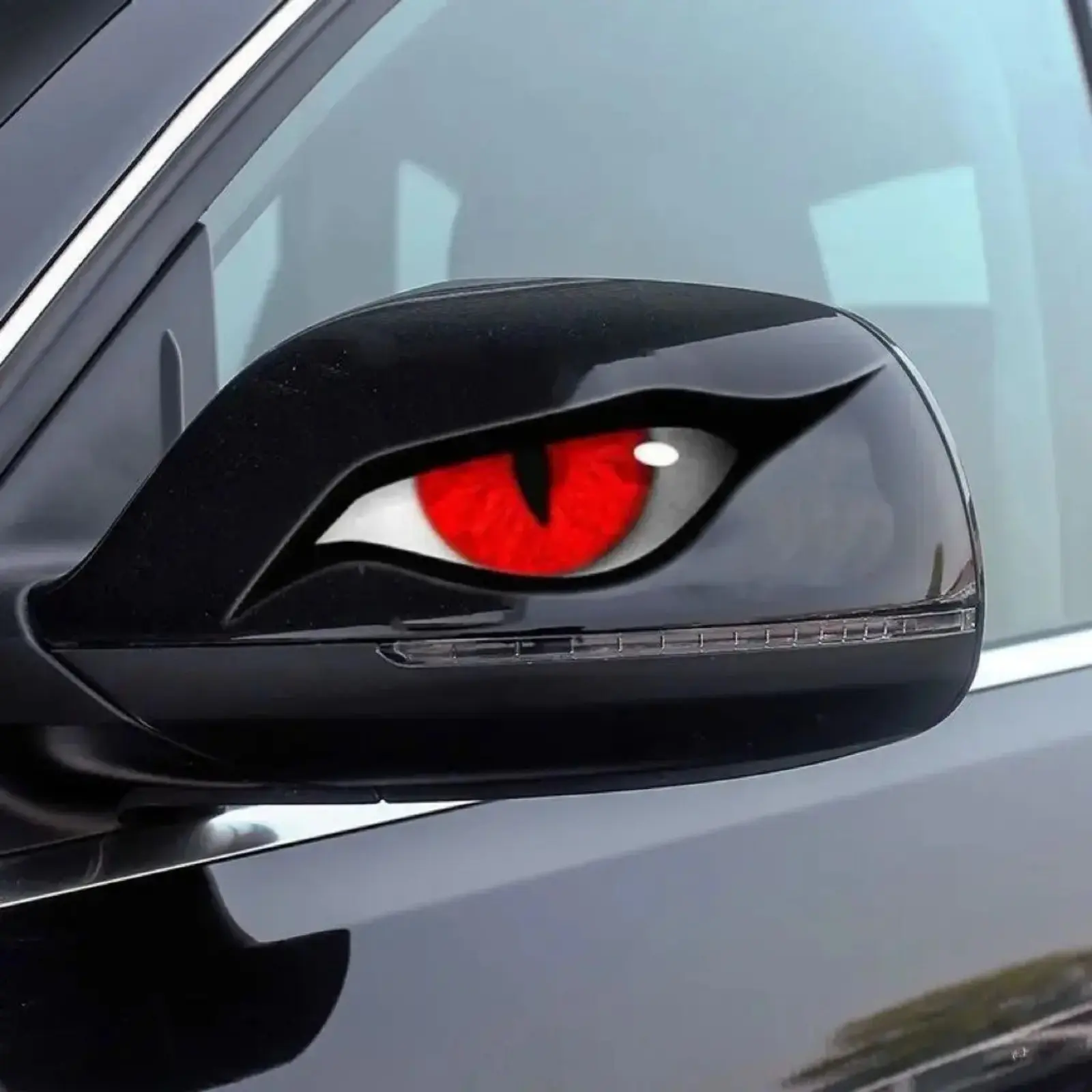 Scary Velociraptor Eye Car Stickers, waterproof red devil eye decals with sun and scratch resistance. Creative rearview mirror decor, spooky auto accessories blending safety and stylish looks.