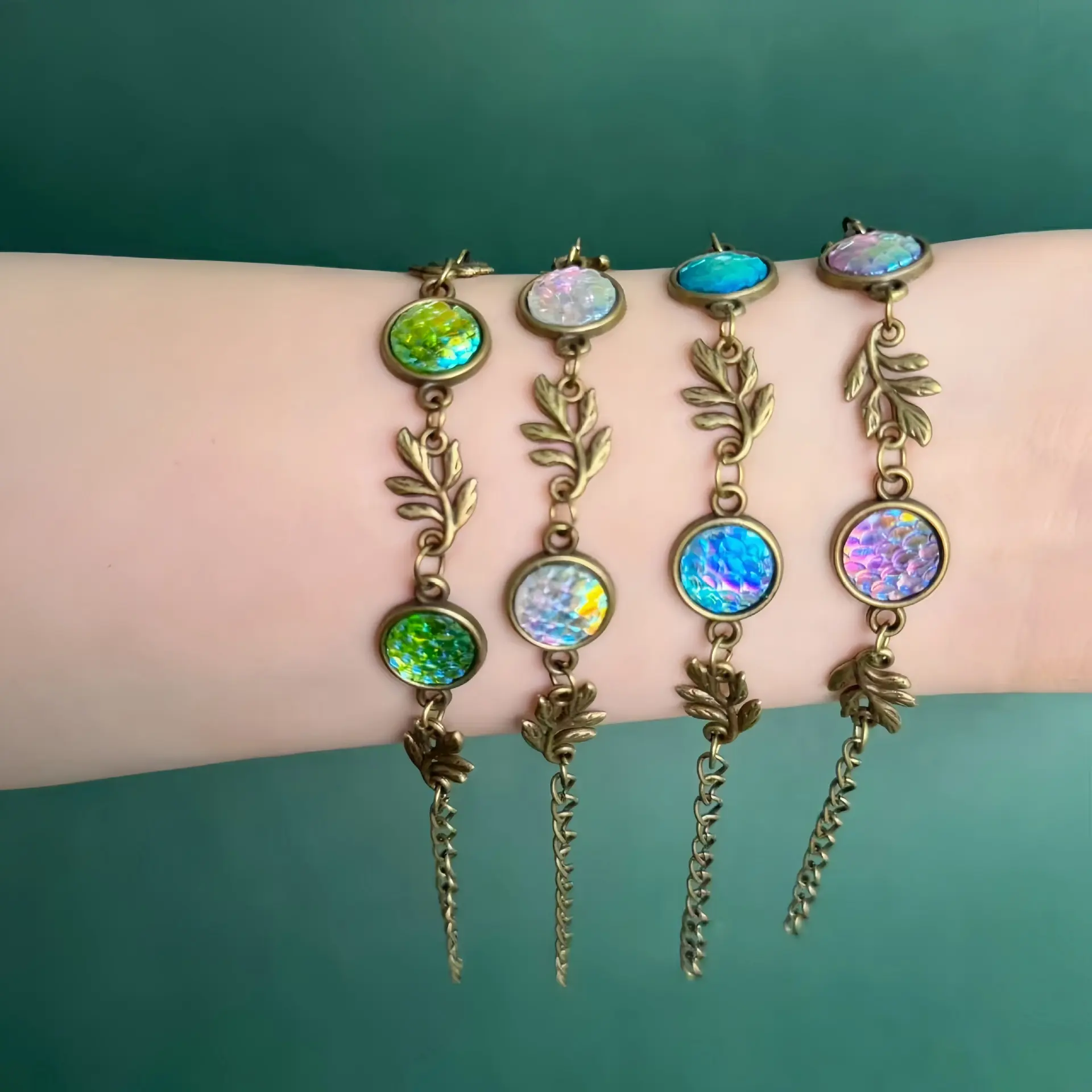 Vintage-style leaf and gemstone bracelet with an antique bronze finish; available in four colors; a perfect gift bracelet featuring a gemstone pendant.