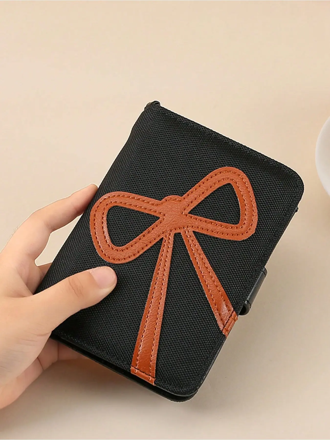 Bowknot passport holder RFID blocking card sleeve, PU creative patchwork passport wallet, multifunctional coin purse with detachable wrist strap, snap closure, waterproof and RFID-blocking travel document wallet