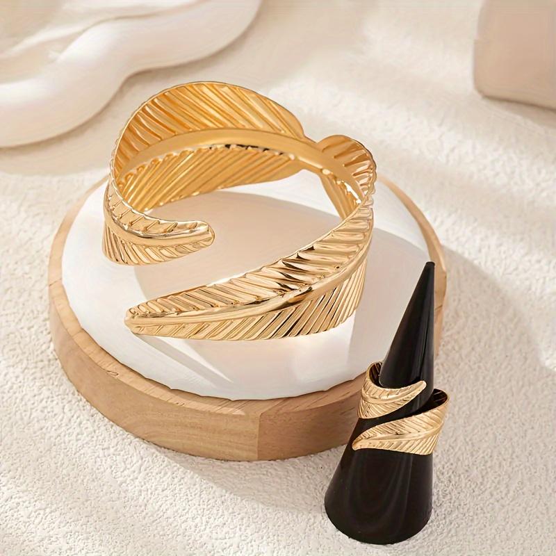 Elegant Gold Feather Textured Cuff Bracelet and Ring Set Nature Inspired Detailed Leaf Pattern Sophisticated Accessory Set for Fashion Enthusiasts and Formal Occasions Cross Necklace Surgical Steel Stud Earrings Mesh Water Drop Plated tiara Silver
