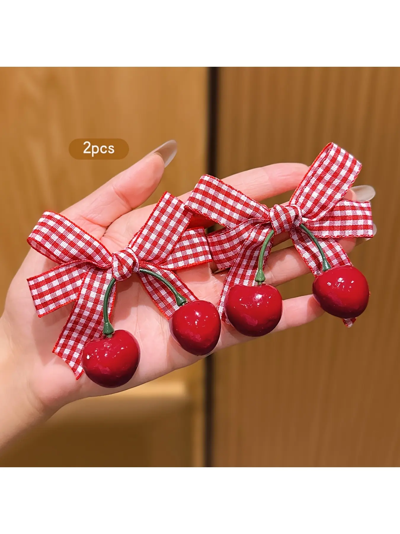 Two red cherry-style bow hair clips, a sweet hairstyle accessory suitable for daily use and at an affordable price.
