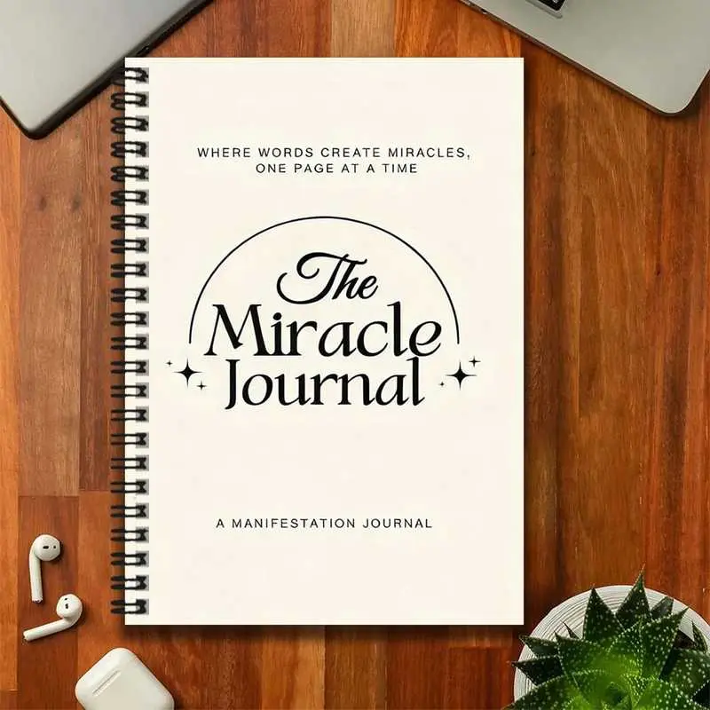 A miracle manifesting spiral notebook, beautifully printed with the words "The Miracle Journal" on the cover. Suitable for work records, study notes, diary writing, daily planning, and other scenarios, it is also an excellent gift choice for graduation ce