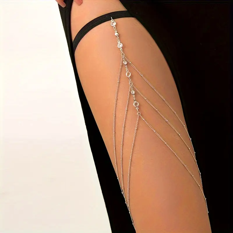 This three-layer tassel rhinestone leg chain is a fashionable and sexy summer accessory that complements any outfit