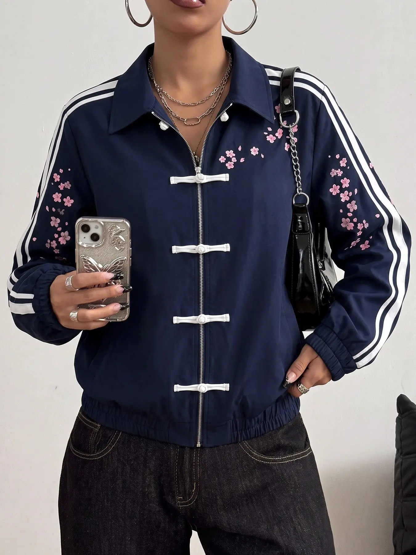 Women's navy blue sports jacket for autumn, with plum blossom print and traditional Chinese frog button design, side stripes, casual street loose fit, suitable for daily commuting, gatherings, walks, and vacation outfits #streetstylejacket #sportjacket