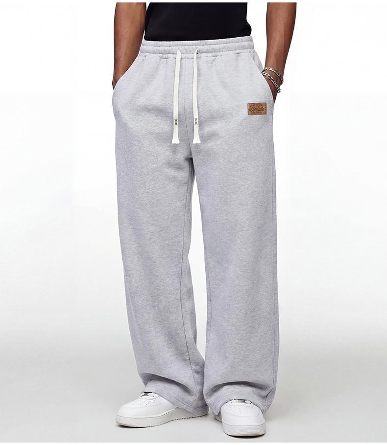 Black loose men's sweatpants, extremely comfortable for daily wear, skin-friendly men's jogging pants, super comfortable with elastic waistband, classic drawstring men's casual sweatpants, suitable for various occasions, and perfect for wearing in autumn