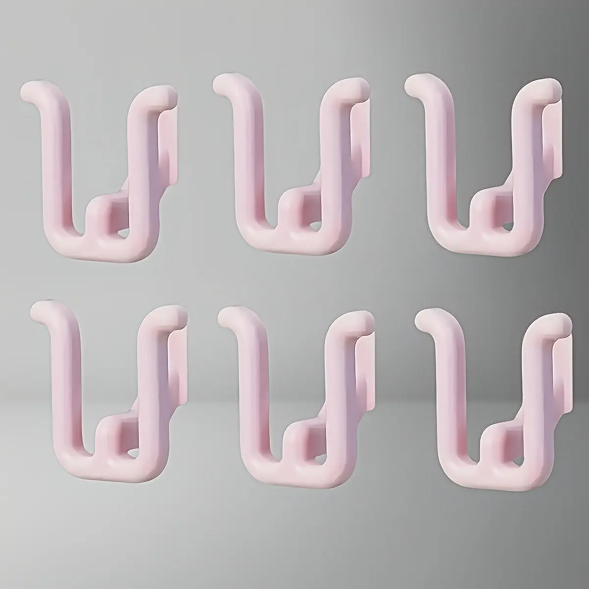 Set of 6 Minimalist Door Hangers in White, Blue, And Pink, Made from Durable Resin. These No-Nail Hooks Are Versatile for Use in Entryways, Wardrobes, And Balcony Storage. They Feature a Easy, Discreet Design for Added Convenience, Utility Hooks