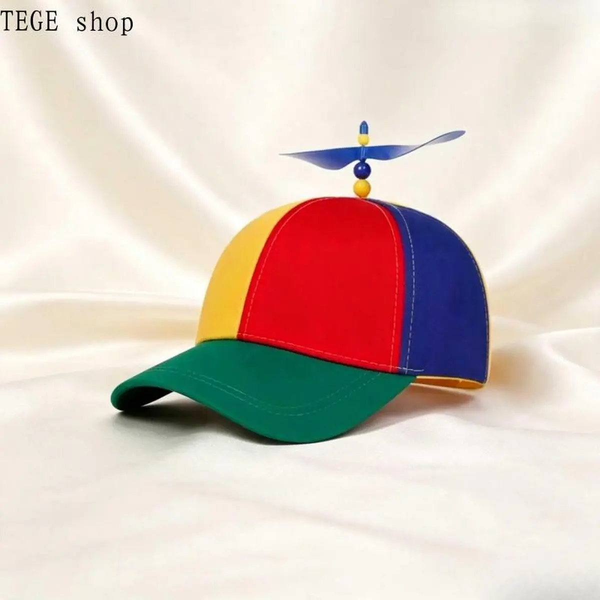 Women's Colorful Propeller Trucker Hat – Features a spinning propeller and adjustable snapback closure; a fun holiday accessory and gift for women.