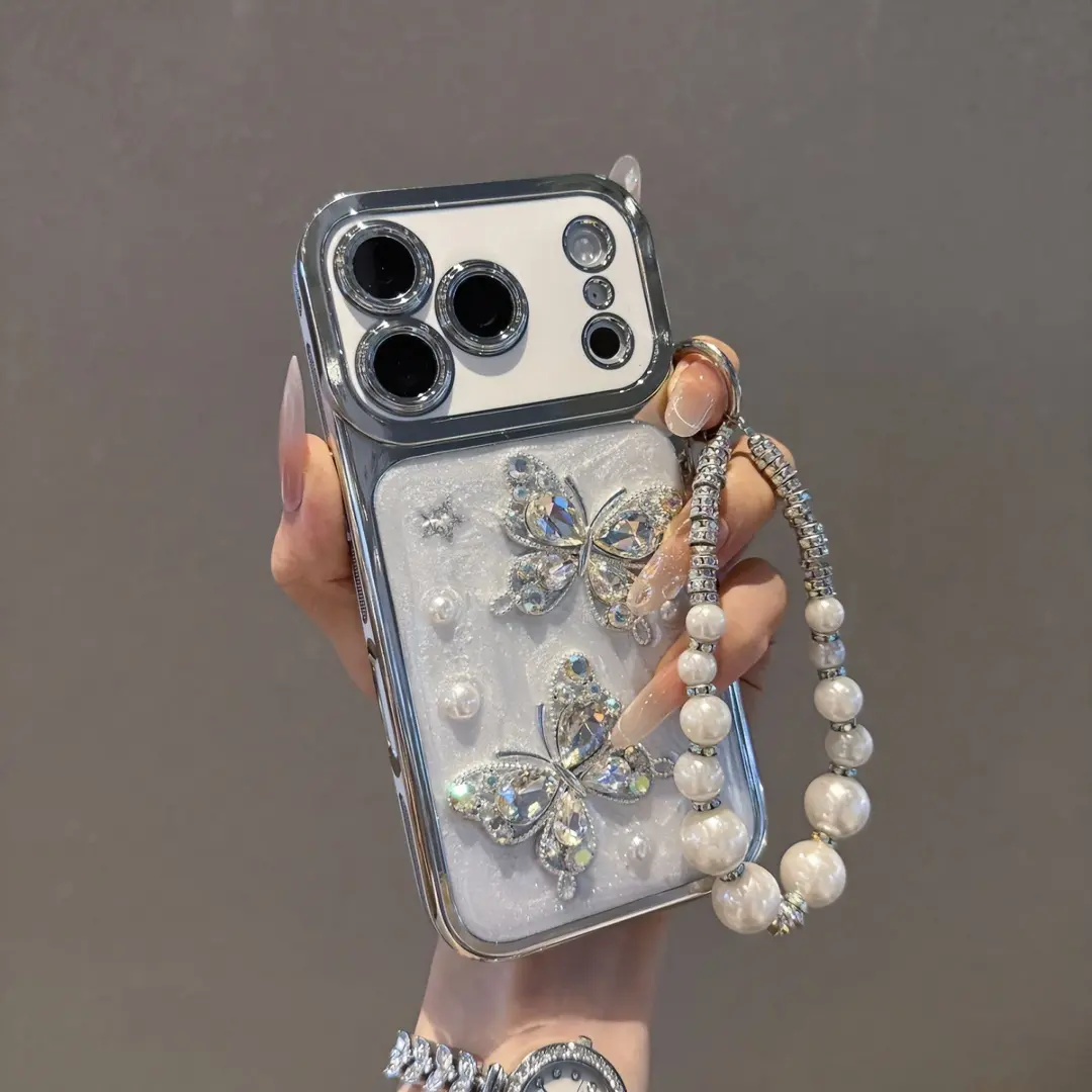 Silver Rhinestone Butterfly Phone Case for iPhone 17/16/15/14 Pro Max - 3D Glitter Design, Electroplated Anti-Slip Frame, Personalized Colored Pearl Hand Strap, Shockproof Protection, High-End Mobile Phone Accessories (iPhone Series Compatible), Large Win