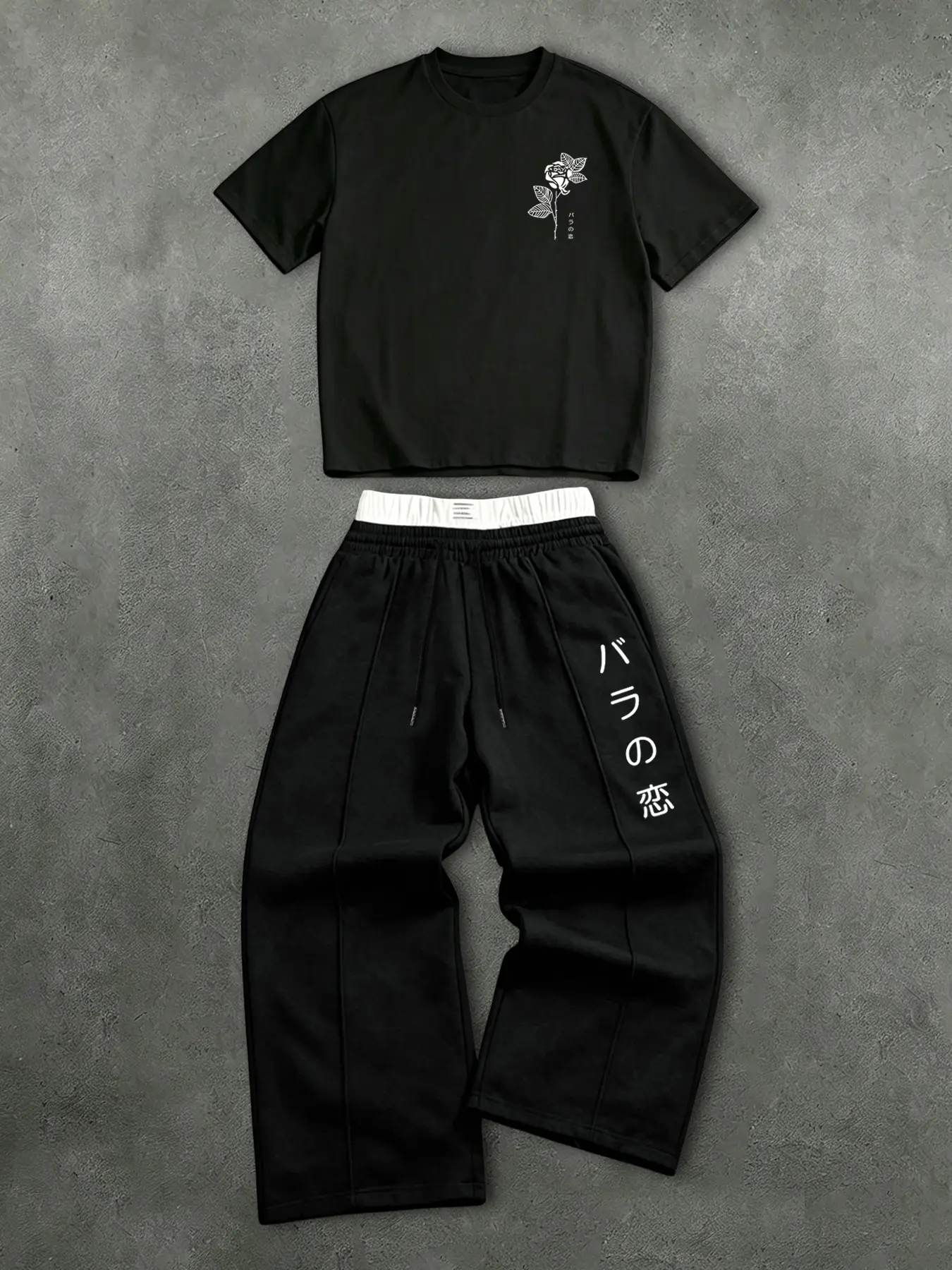 This men's short-sleeved T-shirt set includes a T-shirt with Japanese characters and floral patterns and a pair of double-waisted sweatpants, making it a casual, stylish, comfortable, and breathable two-piece summer outfit for men Print Pants Set