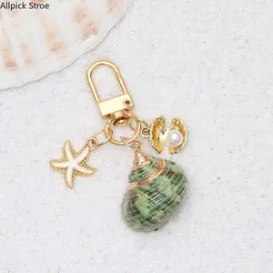 2PCS Coastal Shell Bag Charms, Asymmetrical Starfish and Seashell Keychain Pendant Set, Beach Aesthetic Purse Charm Accessories for Handbags, Tote Bags and Backpacks, Sparkly Ocean-Inspired Bag Decoration for Women, Summer Vacation Style Gift
