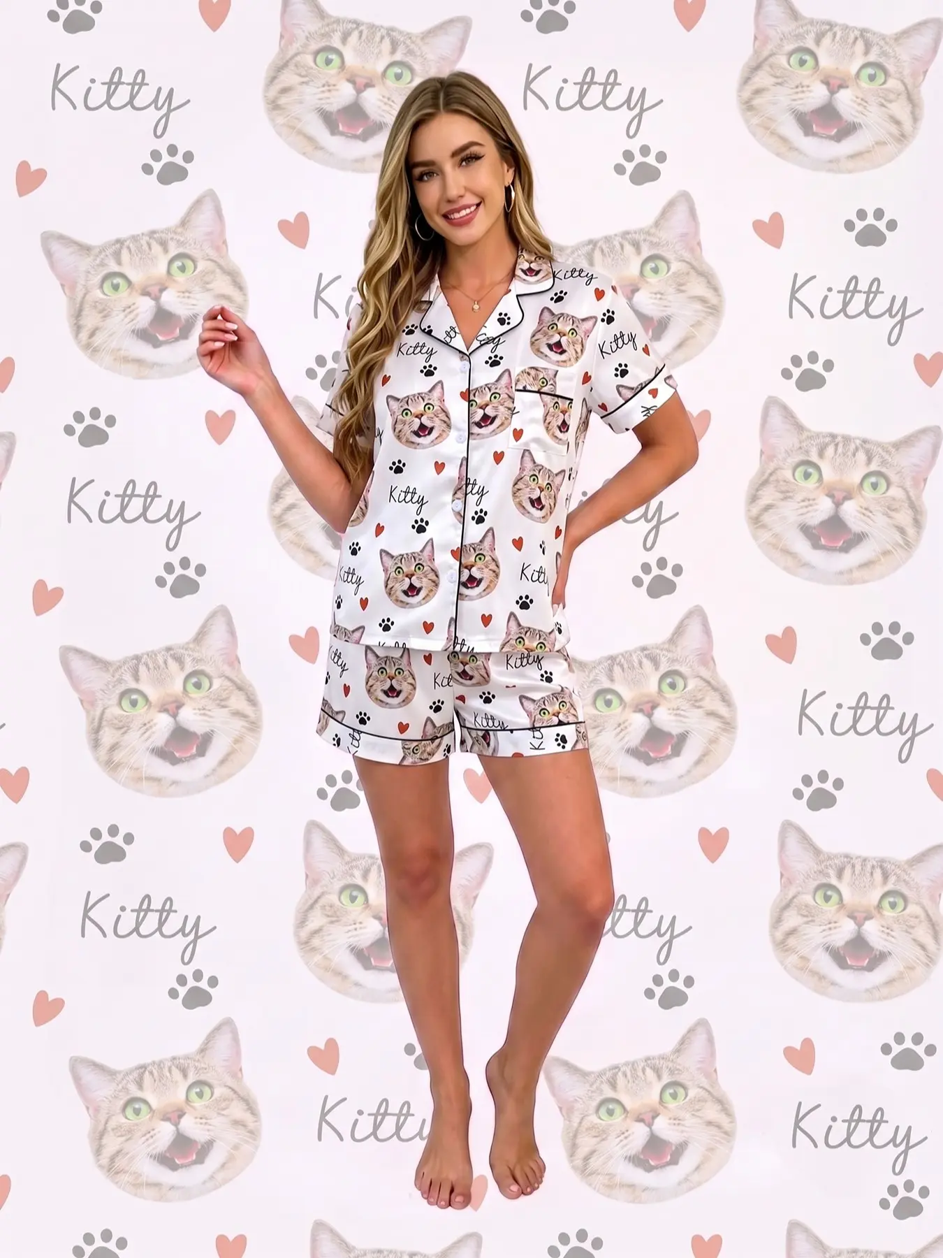Women's 2‑piece pajama set, white base with funny cat face, paw prints, red hearts & hand‑written "Kitty" prints. Playful cute casual girl style. Black trim, lapel top with pocket, elastic‑waist shorts, soft comfy loungewear for all‑season daily wear