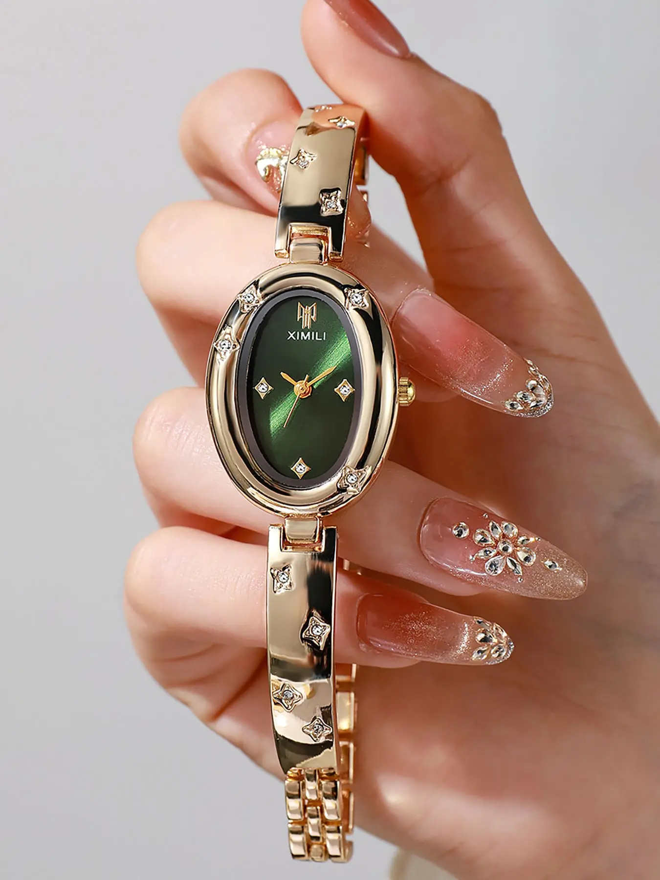 Ladies Wristwatch, Oval Silver Color Dial Analog Quartz Watch, Crystal Star Details, Bangle Watch for Daily Wear and Special Occasions