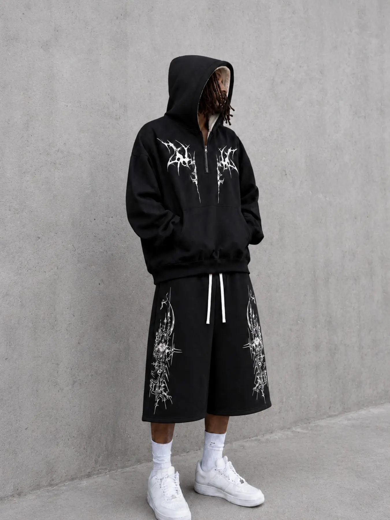 Men's Black Gothic Graphic Hoodie and Bermuda Shorts Set, Oversized Pullover with White Cross and Ornate Prints, Knee-Length Drawstring Shorts, Y2K Streetwear Outfit for Campus, Skate Looks, Festivals, Travel, Casual Weekends, and Hip Hop Styling