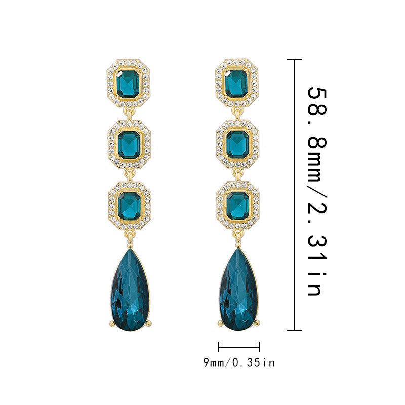 European and American fashion-inspired, premium-designed long-drop-shaped crystal earrings with a dazzling shine. Elegant, versatile, and perfect for cross-border purchases.