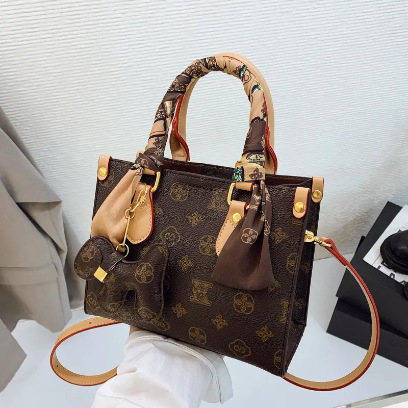 New Women's Affordable Luxury Handbag Compact Portable and Versatile Features a Retro Monogram Print and a Sophisticated Aesthetic Suitable for Hand-Carrying Shoulder or Crossbody Wear
