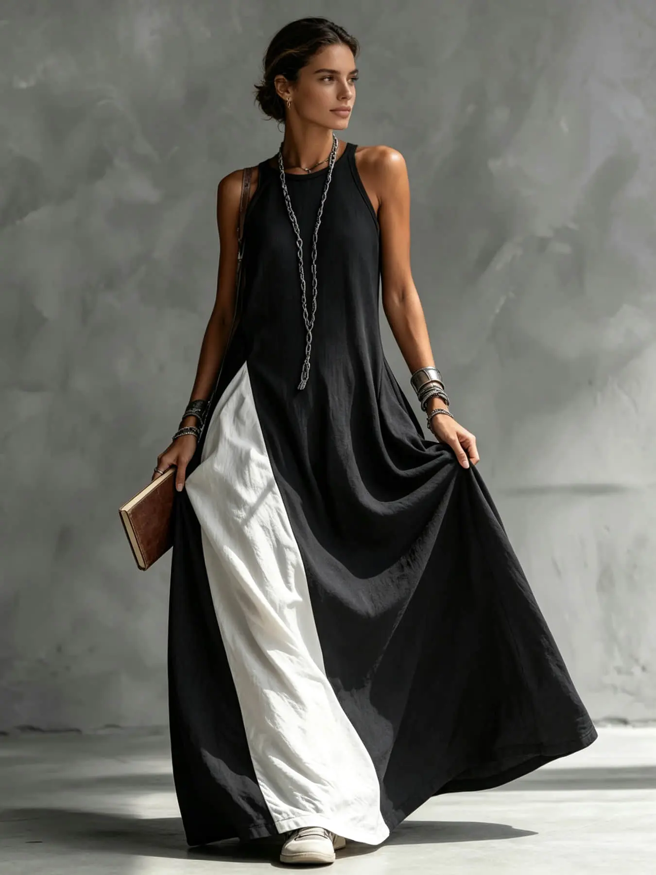 A fashionable and relaxed women's color-blocking dress with sleeveless vest, draping and flesh-concealing long skirt, suitable for summer, beach vacation, exploring shops, attending exhibitions, dating, and enjoying afternoon tea.