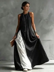 A fashionable and relaxed women's color-blocking dress with sleeveless vest, draping and flesh-concealing long skirt, suitable for summer, beach vacation, exploring shops, attending exhibitions, dating, and enjoying afternoon tea.