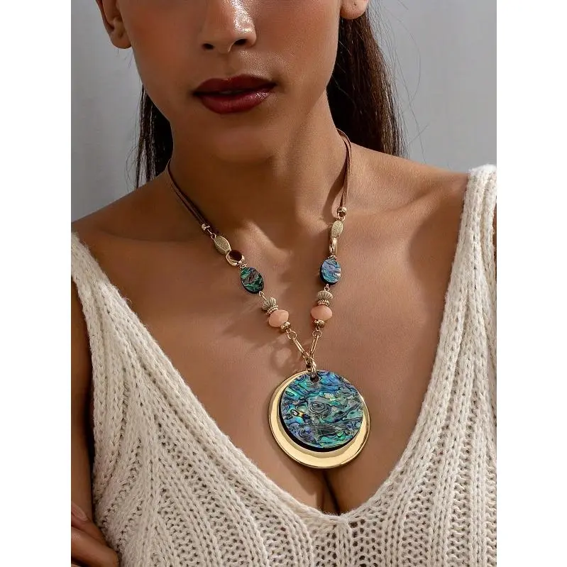 A vintage Bohemian style trendy and stylish exaggerated round geometric abalone shell ethnic chic vacation necklace for women