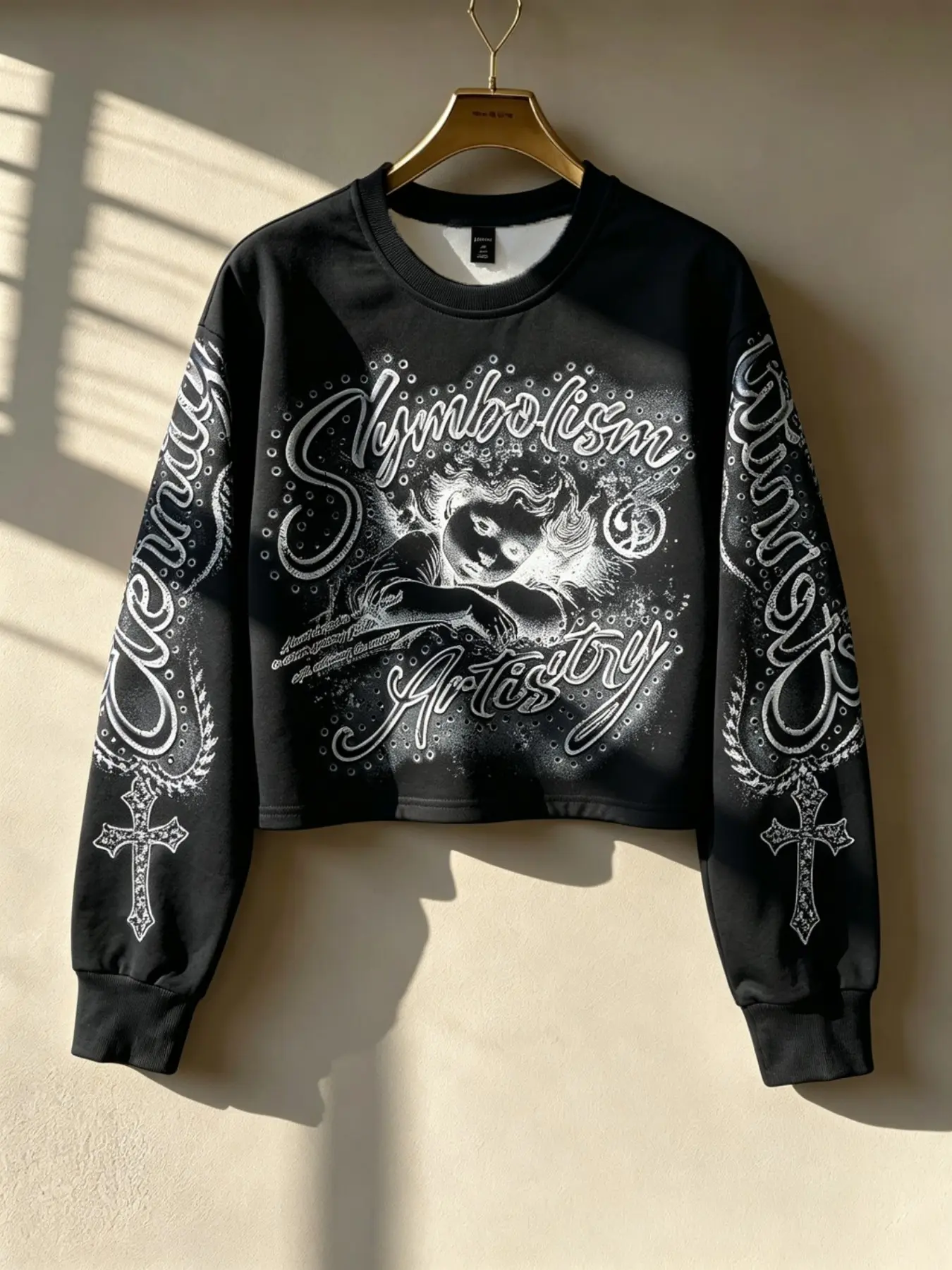 Women's Y2K-style dark gothic sweatshirt—a long-sleeved, crew-neck pullover. It features cherub graphics, a rhinestone cross, and sleeve prints; suitable for street, punk, and emo styles, and perfect for casual wear, parties, or concerts.