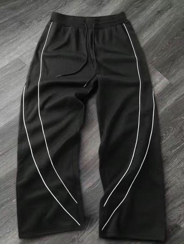 "YOUNG" Embroidered Track Pants | Black Streetwear Wide-Leg Bottoms SpringStatements