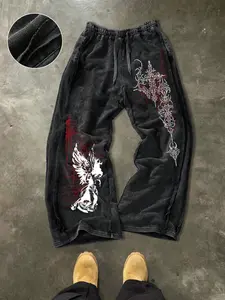 Unisex oversized summer joggers, 100% washed and distressed with side stripes, featuring a dark gothic angel print and a Y2K dark aesthetic. Perfect for Y2K streetwear, sporty, and preppy looks. Pairs well with a vintage denim jacket. Available in multipl