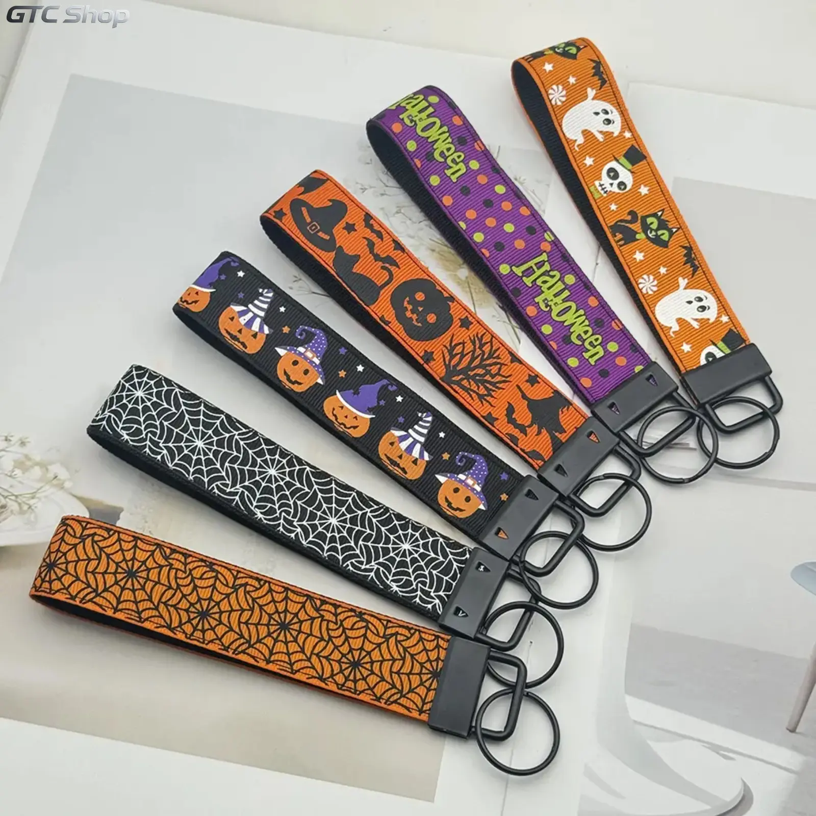 Halloween Wrist Keychain Short Lanyard - Double-Layer Rib-Woven Key Strap with Pumpkin Ghost Spider Web Printed Charm, Holiday Party Gift Bag Accessory for Camping & Hiking Gear