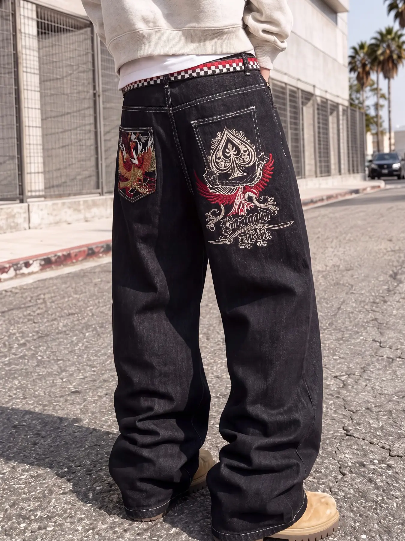 Men's embroidered loose wide-leg denim pants, featuring embroidered graphic detailing on the back pockets, American Y2K street fashion style