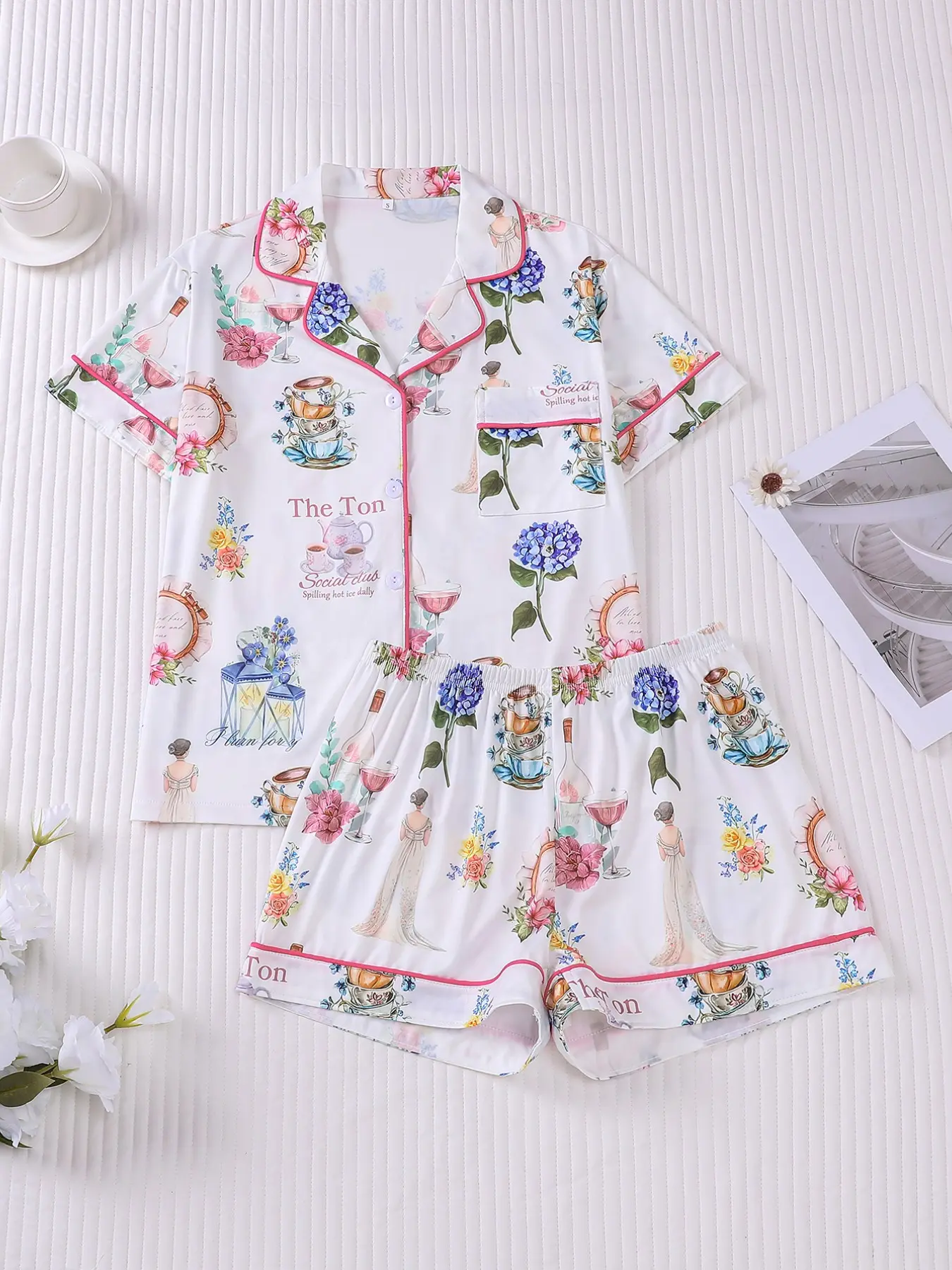 Women's 2-piece pajama set with vintage prints of ladies, hydrangeas, tea sets and wine, soft retro French style aesthetic with pink piping. Lapel top with chest pocket, elastic waist shorts, soft fabric for all-season home loungewear