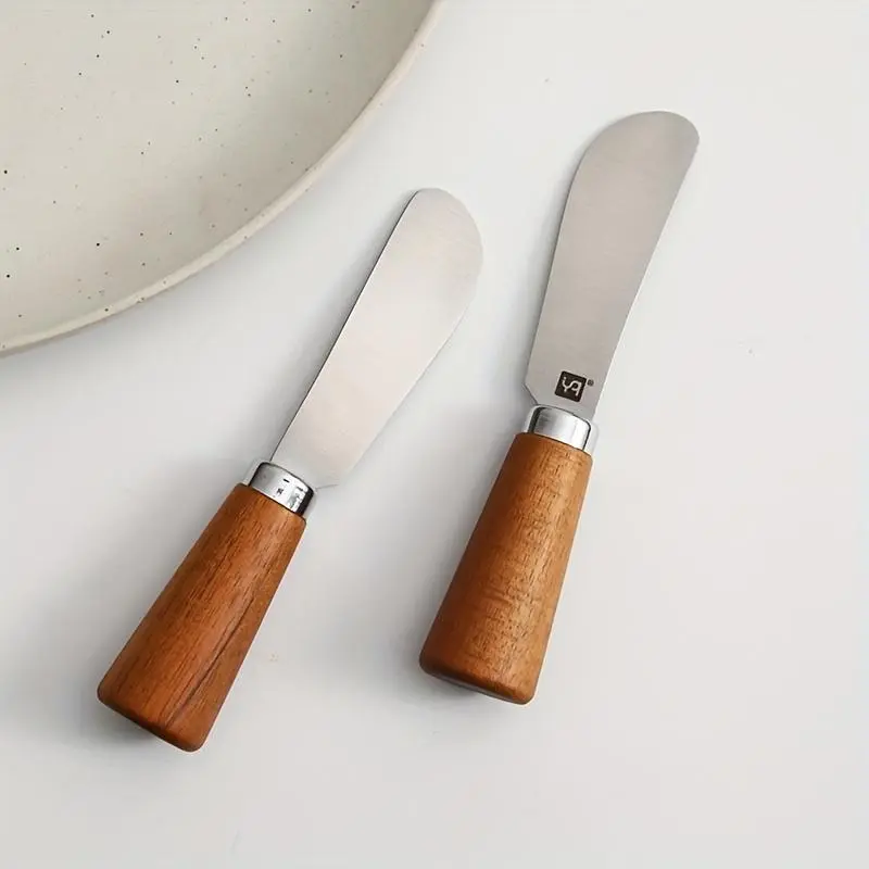 1pc of a Stainless Steel Multifunctional Butter Knife Featuring a Wooden Handle, Ideal for Spreading Cream, Cheese, Jam, And Peanut Butter