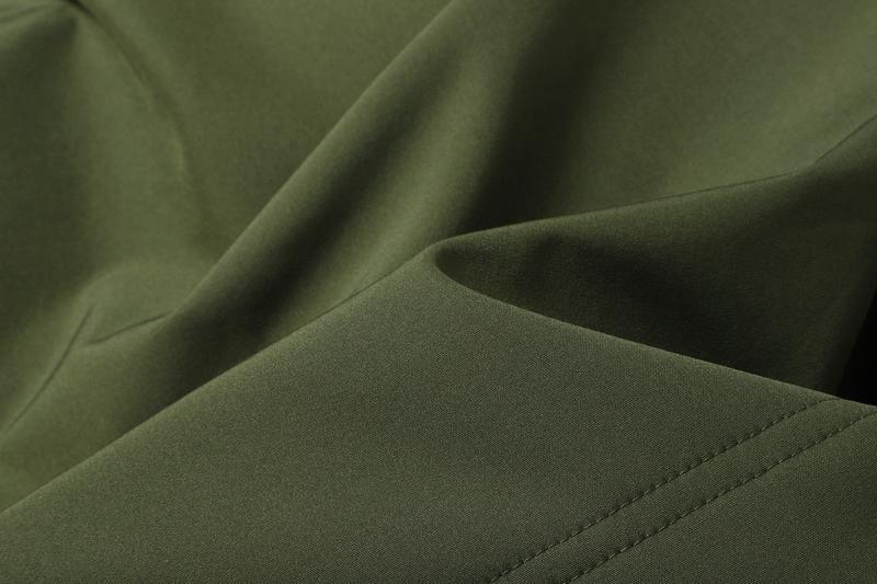 A men's hooded jacket with an outdoor and functional style features multiple zipper pockets distributed on the chest, arms, etc., making it convenient to store various small items and highly practical. Hood with drawstring closure