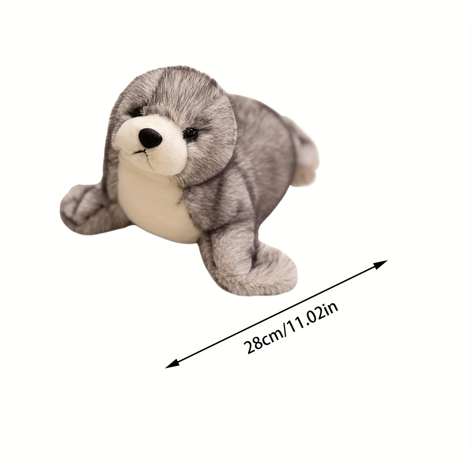 Adorable plush sea lion toy, super soft stuffed animal in a lazy pose, with silky fins suitable for cuddling and sensory play in the nursery