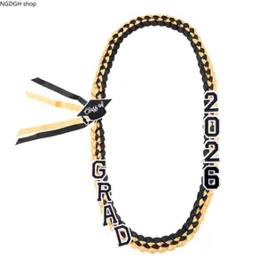 Braided Graduation Lei Ribbon Class of 2026 - Trendy Black Gold Blue Yellow GRAD Necklace with Cap Charm & Large Letters, Lightweight Durable Handmade Design Perfect for Senior Ceremony Photos Party & Celebration Getaways