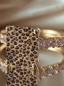 Leopard print square-shaped statement ring with wild pattern design. Side embellishments add a touch of flashiness, creating a cool and bold personalized ring Ring Jewelry