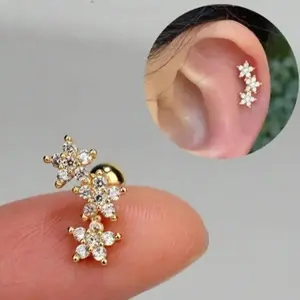 16G Floral Cartilage Earrings, three-flower cubic zirconia design. Hypoallergenic stainless steel fits daith, conch, tragus and helix piercings. Sparkling delicate piercing jewelry for daily looks and party outfits.