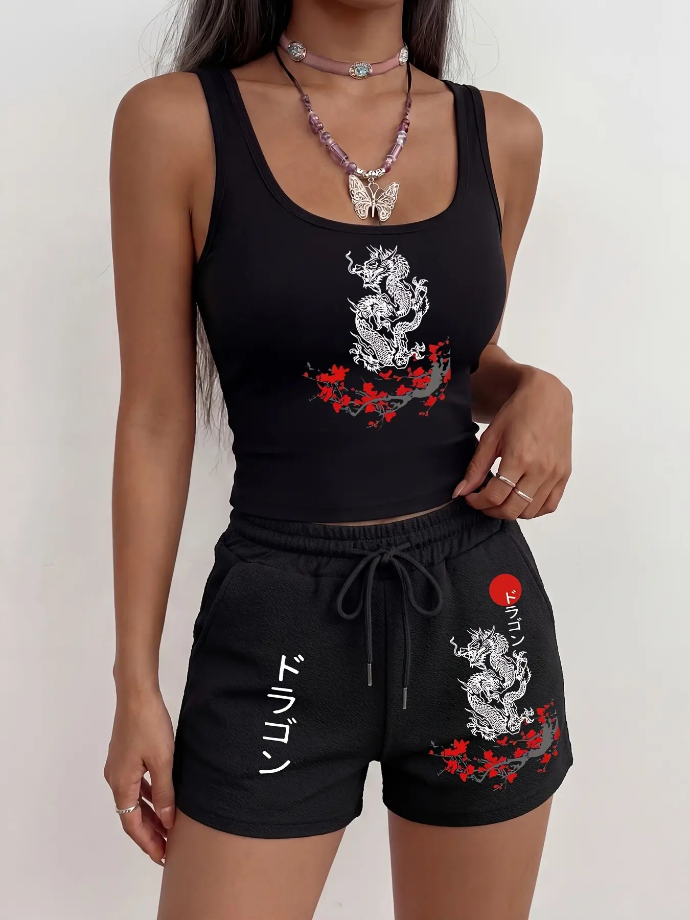 Y2K-style two-piece set featuring an Oriental dragon and cherry blossom print; crafted from textured ribbed fabric; designed for a slimming, midriff-baring, and effortless look Sleeveless Top Casual Pants Set