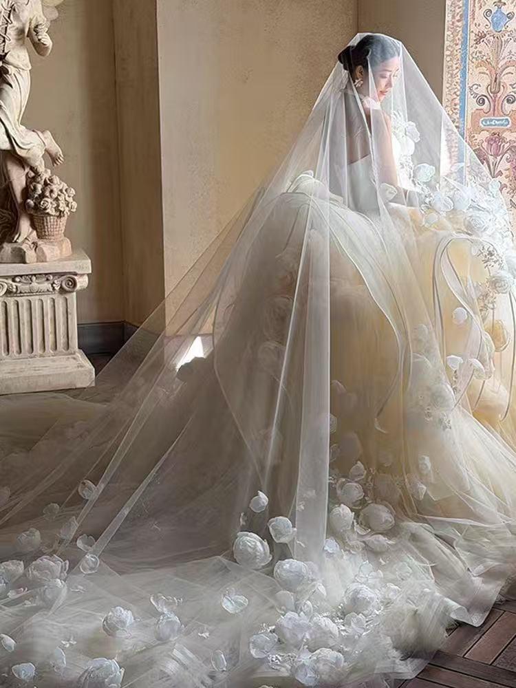 Luxury-style long veil with dreamy, elaborate floral designs and a cathedral-style train